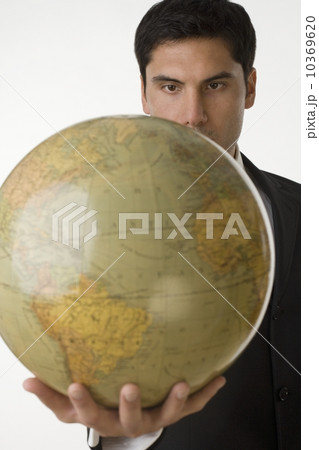 Man holding globe 10369620