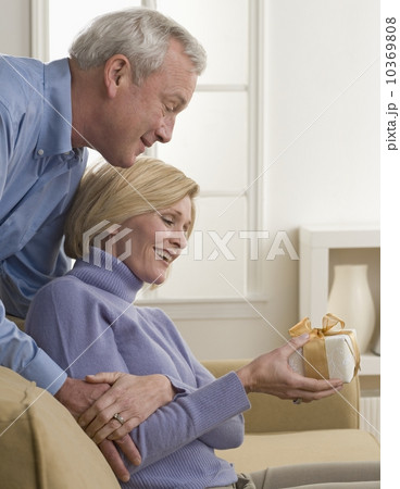 Man surprising wife with gift Man surprising wife with gift 10369808