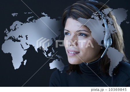 Woman wearing headset with map of world 10369845