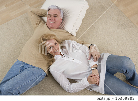 Senior couple lying on floor Senior couple lying on floor 10369885
