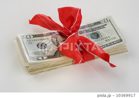 A stack of money with a bow A stack of money with a bow 10369917