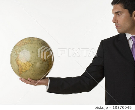 Man holding globe Man holding globe 10370049