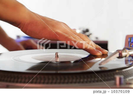 Person mixing sound from records 10370109