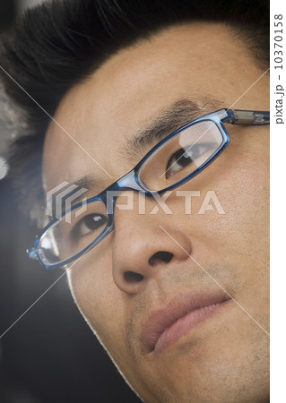 Headshot of man wearing glasses Headshot of man wearing glasses 10370158