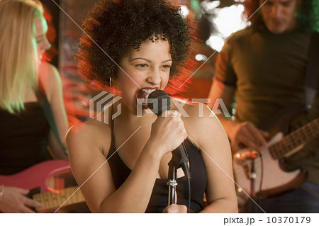 Woman singing with a band 10370179