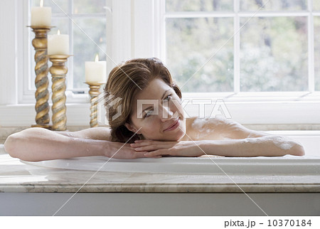Woman relaxing in bathtub Woman relaxing in bathtub 10370184