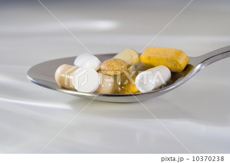Still life of a spoonful of pills 10370238