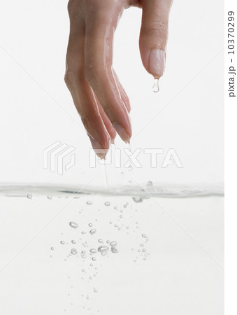 Hand touching water Hand touching water 10370299