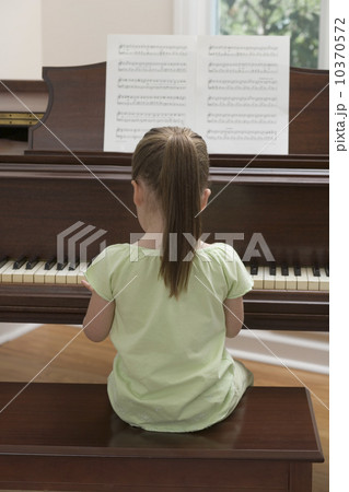 Young girl playing piano 10370572
