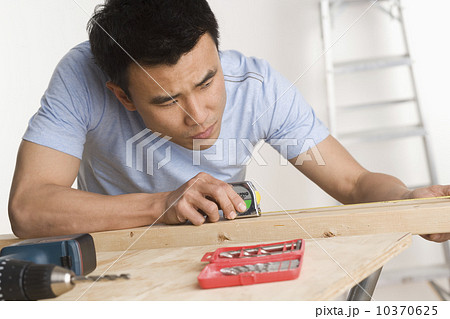 Man doing home repairs Man doing home repairs 10370625