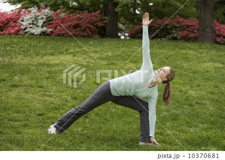 Woman stretching in park Woman stretching in park 10370681