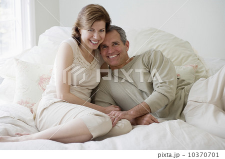 Couple hugging on bed Couple hugging on bed 10370701
