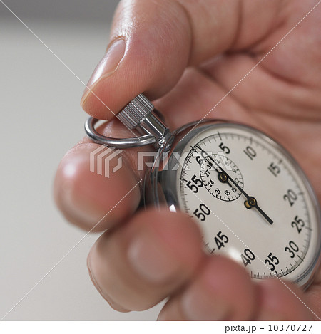 Hand holding stop watch 10370727