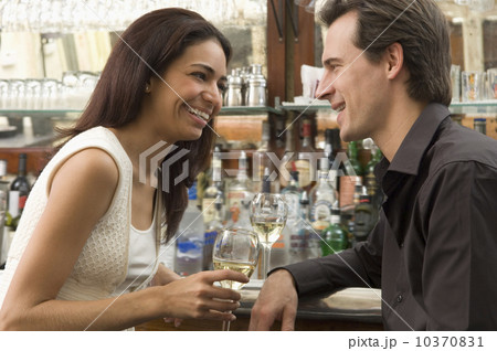 Couple talking at bar 10370831