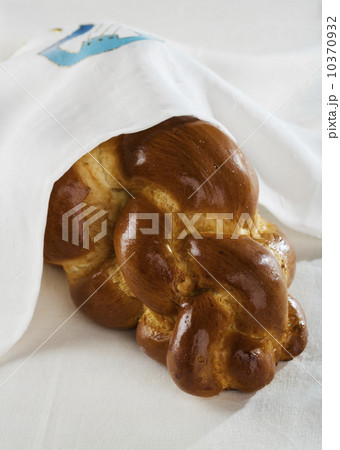 Loaf of Challah bread under cloth 10370932