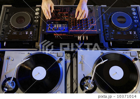 Person mixing music in a nightclub 10371014