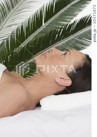 Woman lying on her back at spa 10371072