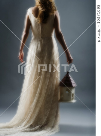 Woman wearing a long white dress 10371098