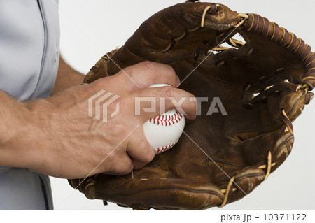 Close up of man with baseball glove and baseball 10371122