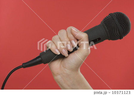 Woman holding microphone Woman holding microphone 10371123