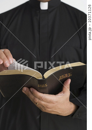 Close up of bible in priest’s hands 10371126