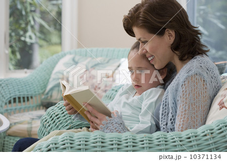 Mother reading to young daughter Mother reading to young daughter 10371134