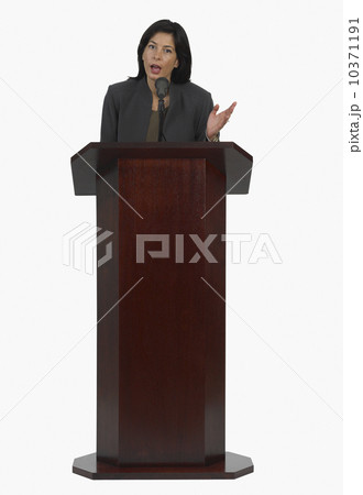 Businesswoman speaking at podium 10371191