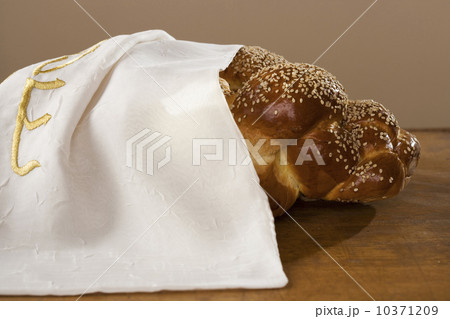Loaf of Challah bread under cloth Loaf of Challah bread under cloth 10371209