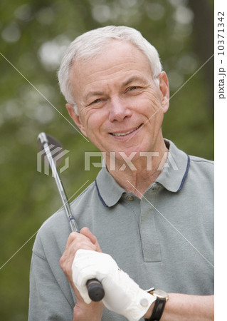 Portrait of senior man with golf club Portrait of senior man with golf club 10371342