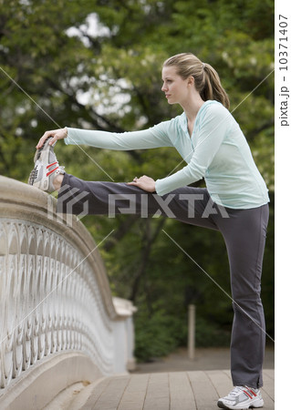 Woman stretching in park Woman stretching in park 10371407