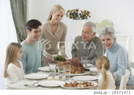 Family eating at Thanksgiving table Family eating at Thanksgiving table 10371471