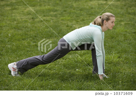 Woman stretching in park 10371609