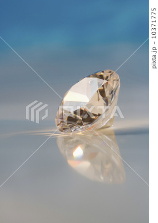 Closeup of a sparkly clear faceted gem Closeup of a sparkly clear faceted gem 10371775