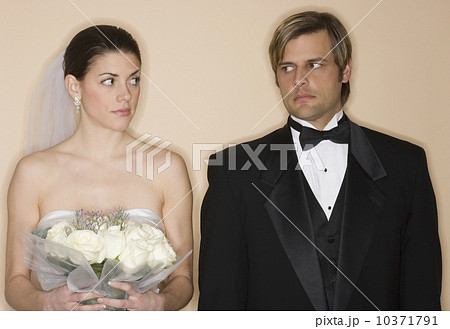 Angry bride and groom looking at each other Angry bride and groom looking at each other 10371791