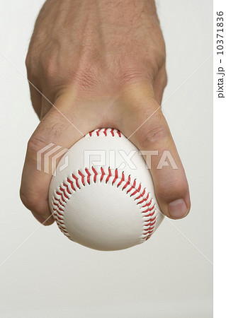 Close up of pitcher holding baseball 10371836