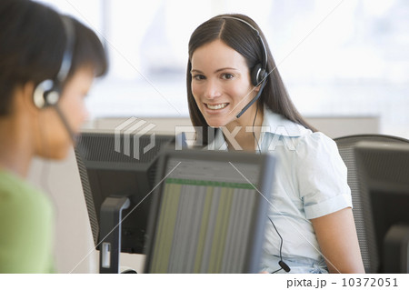 Businesswoman wearing headset Businesswoman wearing headset 10372051
