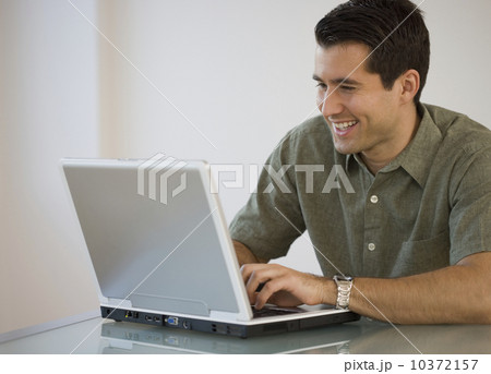 Man typing on laptop Man typing on laptop 10372157