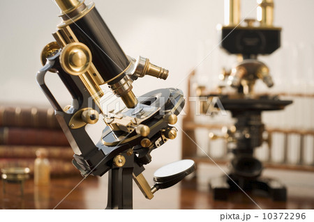 Old fashioned microscopes on table Old fashioned microscopes on table 10372296