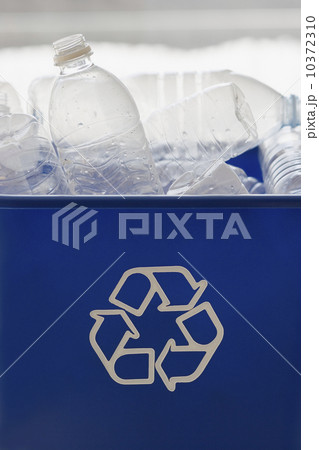 Recycle bin filled with bottles 10372310