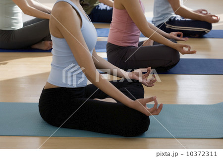 Group of people practicing yoga 10372311