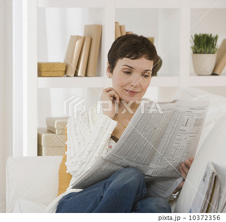 Woman reading newspaper 10372356