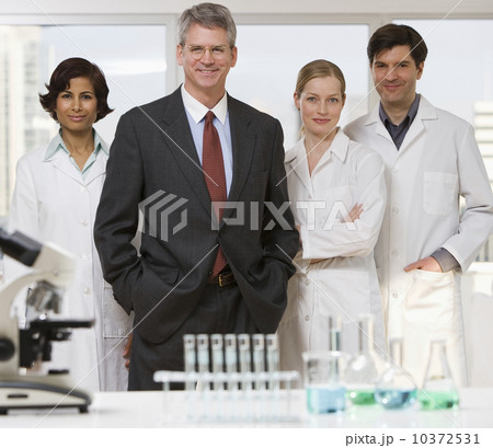 Businessman and scientists in laboratory 10372531