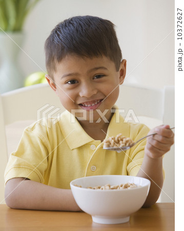Asian boy eating cereal 10372627