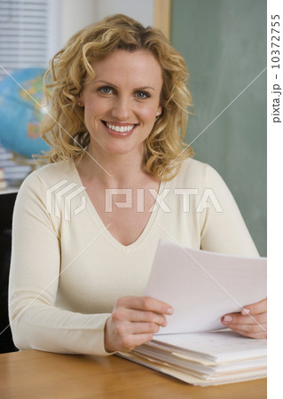 Portrait of female teaching in classroom Portrait of female teaching in classroom 10372755
