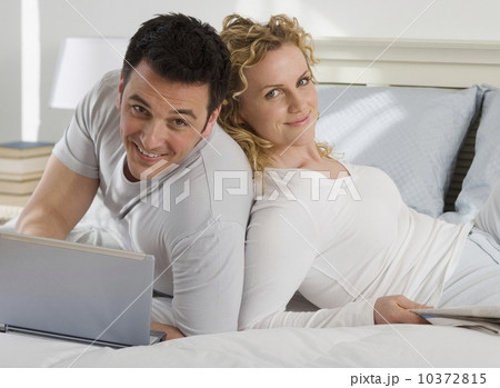 Portrait of couple on bed 10372815