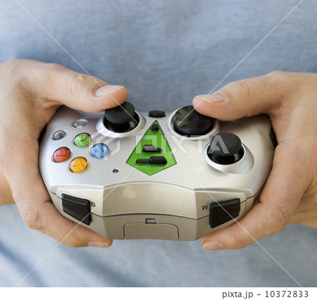 Man holding video game controller Man holding video game controller 10372833