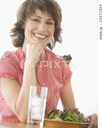 Woman eating salad Woman eating salad 10372954