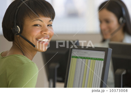 African businesswoman wearing headset African businesswoman wearing headset 10373008