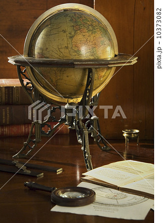 Old fashioned globe in stand on table 10373082
