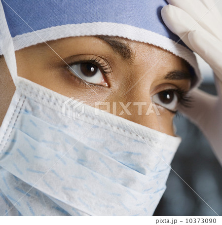 Indian female doctor wearing surgical mask Indian female doctor wearing surgical mask 10373090